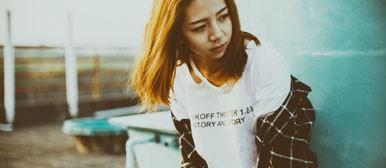 girl leaning on wall